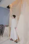純白繡花 交叉鏤空織帶流蘇洋裝