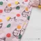 彩色糖果貓咪繪圖淺粉上衣